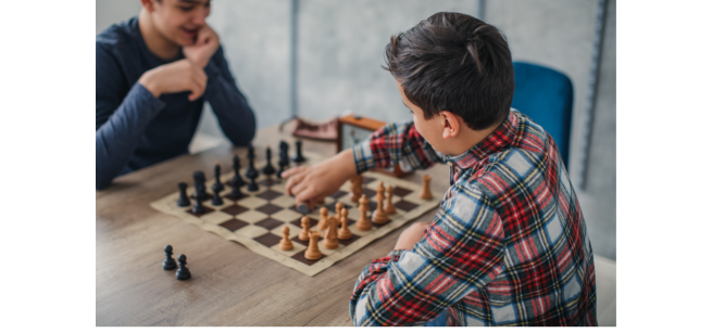 Two boys playing chess.