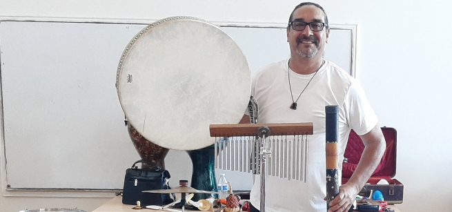 Roberto "Kongakid" Gutierrez with drums and percussion instruments