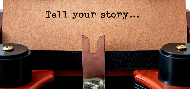 Page in typewriter reads "Tell your story"