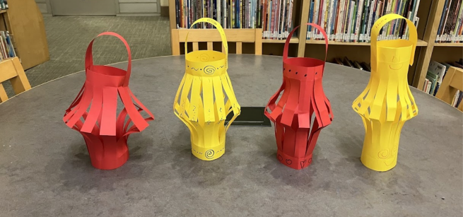 Red and yellow paper lanterns on a table