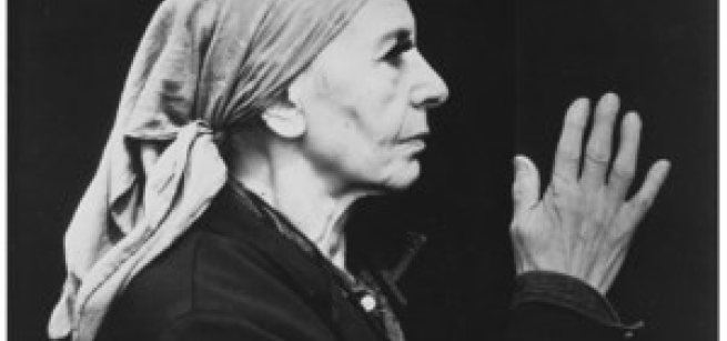 black adn white image of Louise Nevelson wearing a headscarf