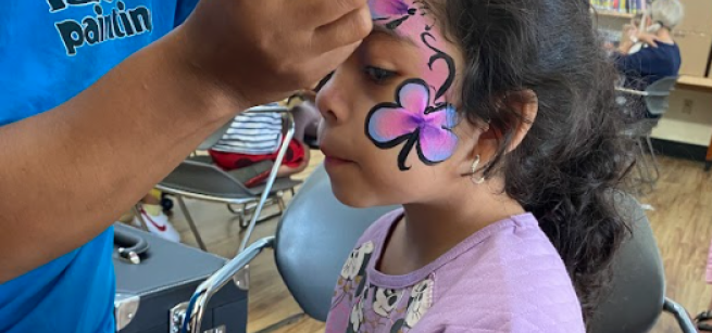 child getting their face painted