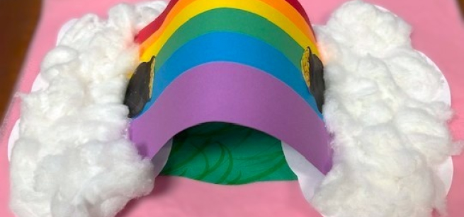 Three Dimensional paper rainbow craft with cotton balls as clouds.