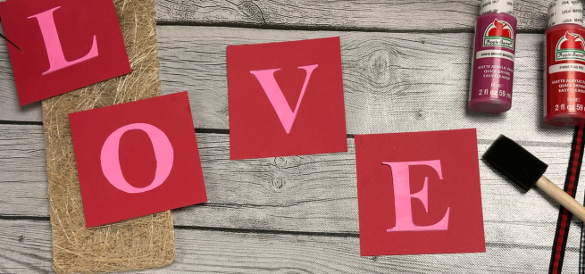 Love Sign on a red painted square