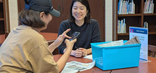 one adult tutoring another adult