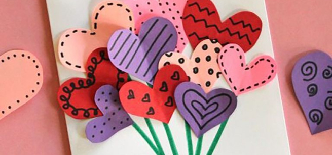 Handmade Valentine's Day card with a hand bouquet in the center
