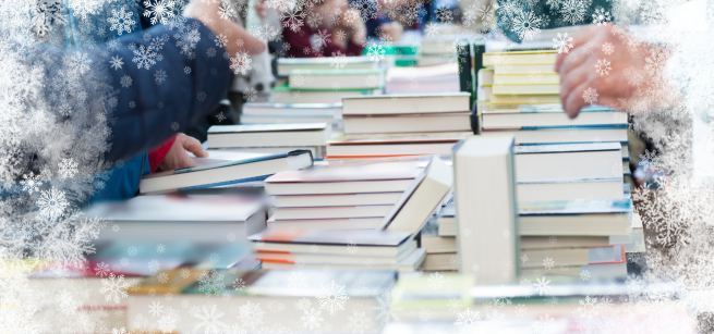 A table of books with a border of snowflakes