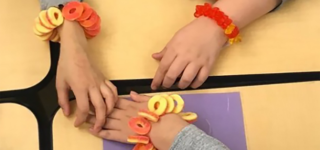 Hands with candy bracelets
