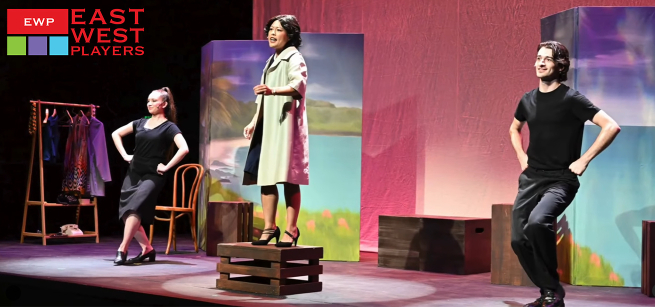 Three performers on stage acting