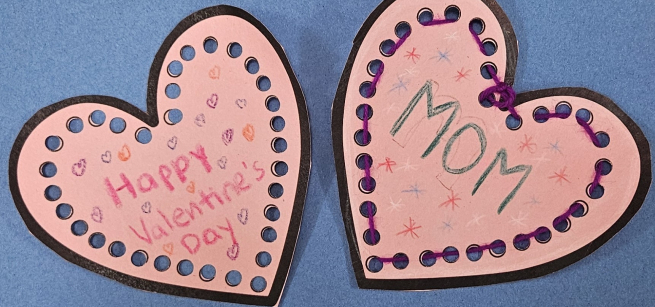 two pink hearts with mom and happy valentine's written on them.
