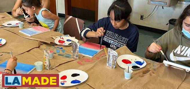 kids painting at a library event