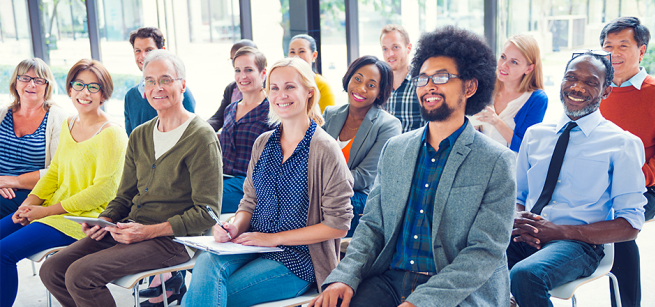 Group of adults listening to a lecture