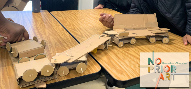 small cardboard vehicle on a table