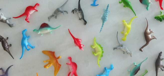 various colored dinosaur toys