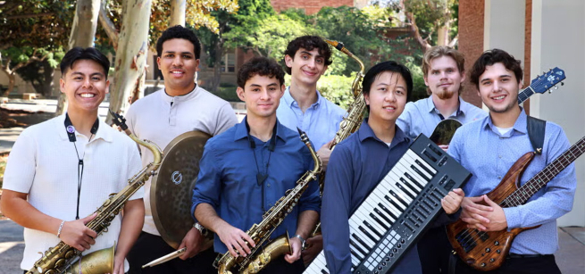 Seven young men holding different musical instruments