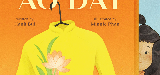 An image of the book cover to The Yellow Ao Dai shows a little girl looking out behind a yellow Vietnamese traditional gown that is decorated with pink lotus flowers.