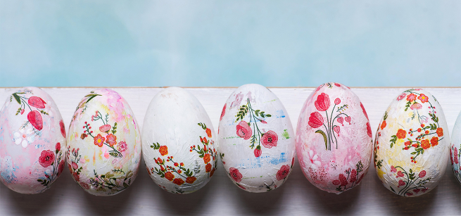 a row of decoupage eggs with floral designs
