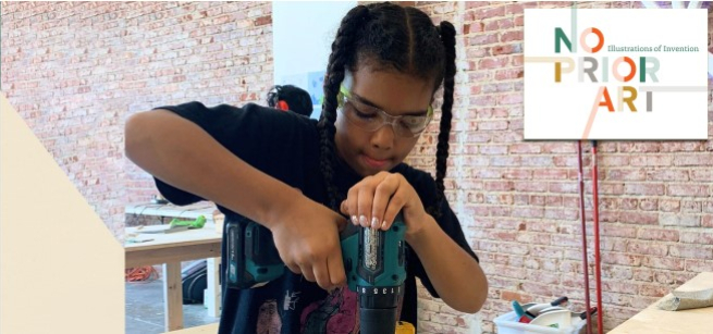 little girl using a drill