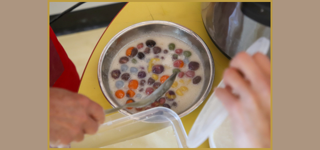 Picture of Michael Rayner preparing hand rolled sticky rice dumplings