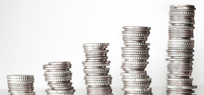 Five stacks of sliver coins