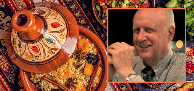 Portrait of Charles Perry next to a colorful piece of Moroccan pottery