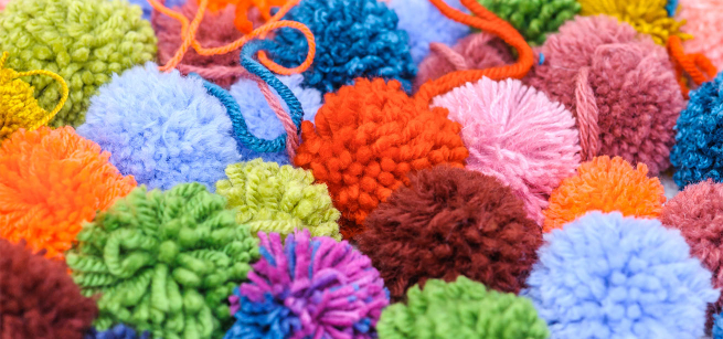 Colorful yarn pom-poms.