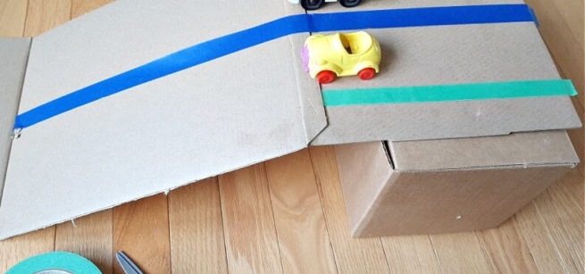cardboard ramps and toy cars
