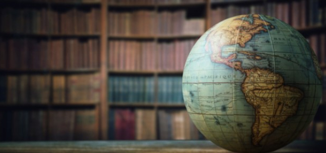globe in front of book shelves