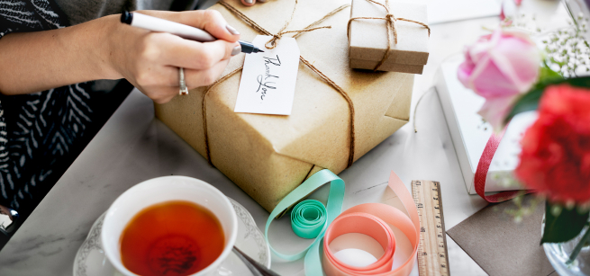 Hands wrapping a gift 