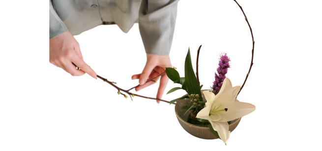 Individual arranging flowers