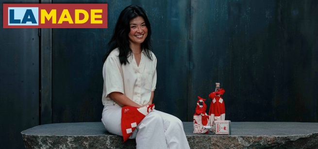 a person posing and smiling in front of a few wrapped items
