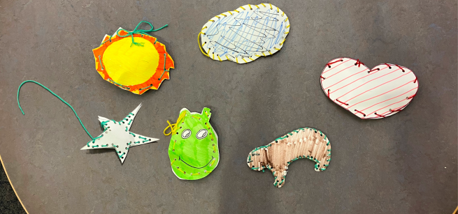 Stuffed animals made out of paper and yarn.