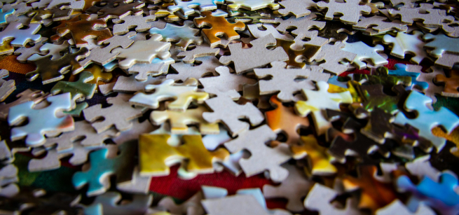 pile of multicolored jigsaw puzzle pieces