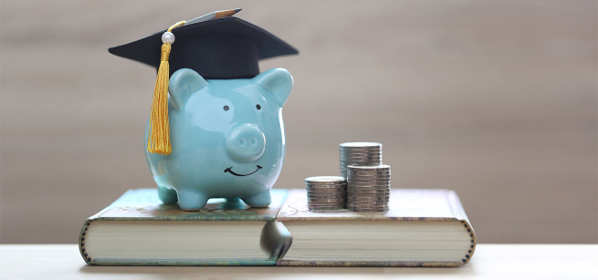 a blue piggy bank with a graduation hat. 