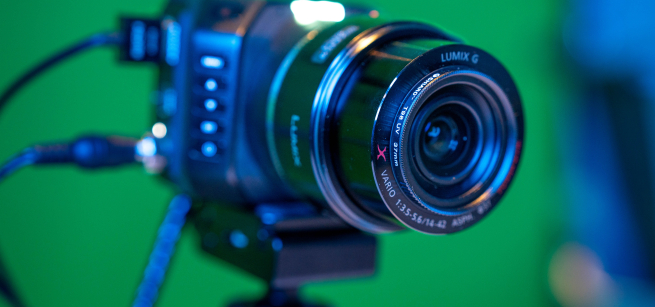 close up of a camera in front of a green screen