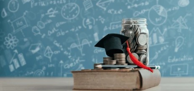 Image of jar of coins, graduate cap on top of book