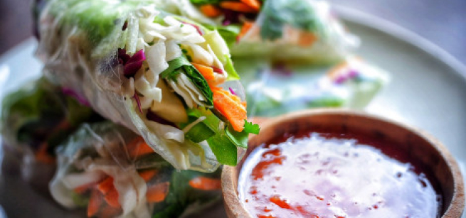Vietnamese rolls next to sauce
