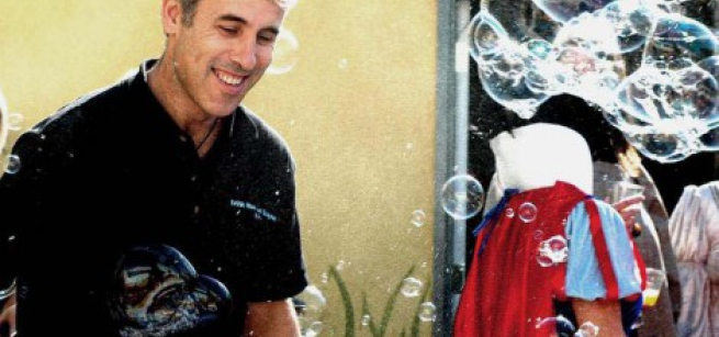 a person surrounded by large bubbles