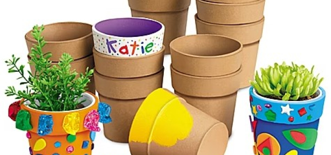 Collage pots made of thick durable papier-mâché, painted bright colors and decorated with stickers.