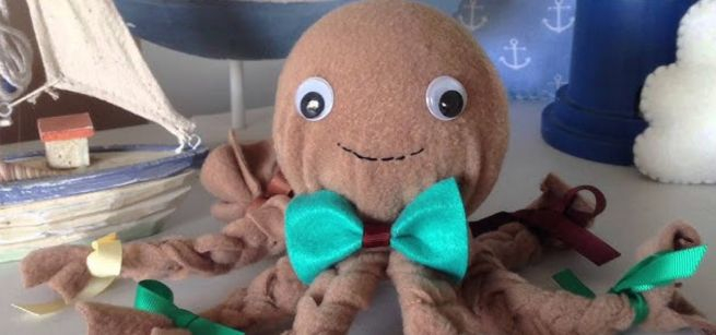 A fleece octopus with a bow tie and googly eyes