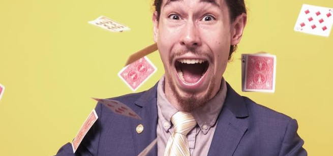 Magician with cards flying around