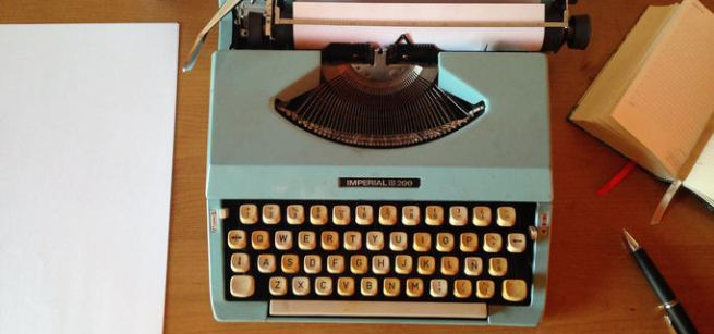 Desk with Typewriter, Pen, and Paper.