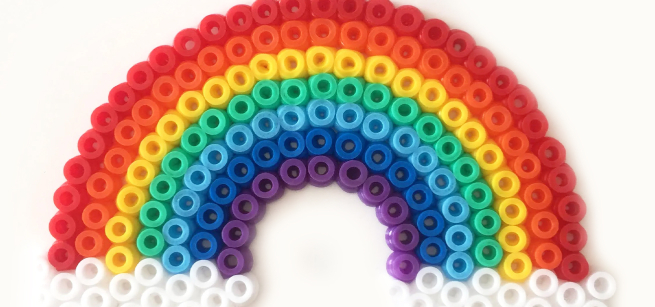 perler beads forming a rainbow
