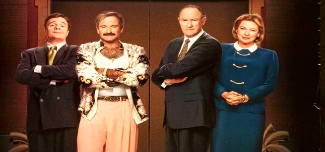 Three men and one woman standing