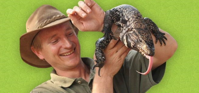 man holding a reptile