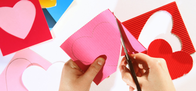 hands cutting out art crafts