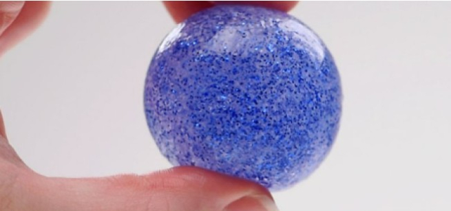 A blue glitter bouncy ball.