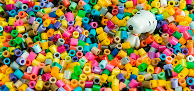 Colorful plastic beads with a cartoon dog among them