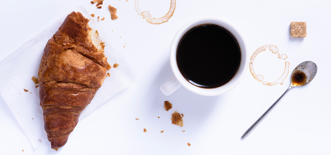 Pastry croissant and a mug of coffee