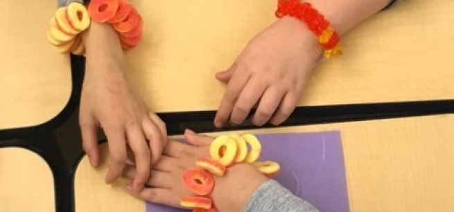 Arms with candy jewelry bracelets